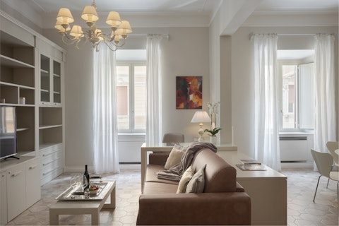 Unwind in a light-filled space with tall Roman windows