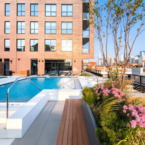Take a dip in the communal pool with city skyline views