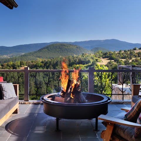 Enjoy mountain views while relaxing by the fire pit