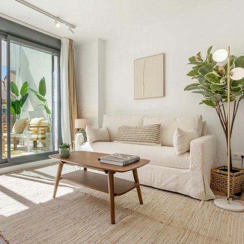 Enjoy a glass of Spanish sangria while basking in the sun on the sofa