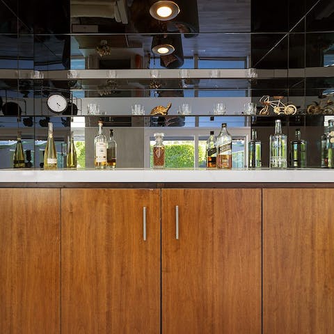 Whip up drinks at the decked-out home bar