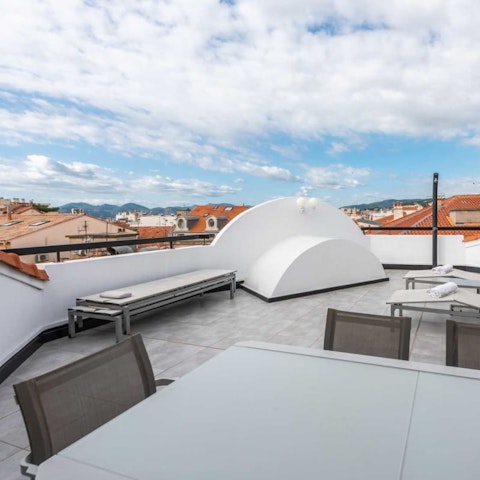 Dine alfresco on the terrace with views over the rooftops