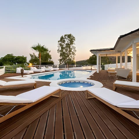 Savour long soaks in the hot tub as the sun sets