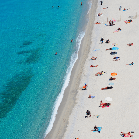 Spend days relaxing on Fig Tree Bay, just a two-minute walk from your villa