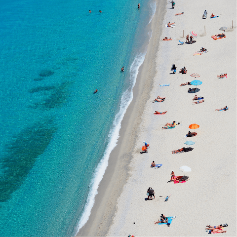 Spend days relaxing on Fig Tree Bay, just a two-minute walk from your villa