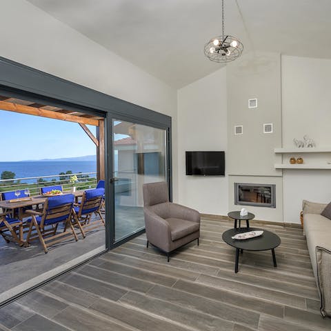 Take in beautiful sea views from the living room's sliding doors
