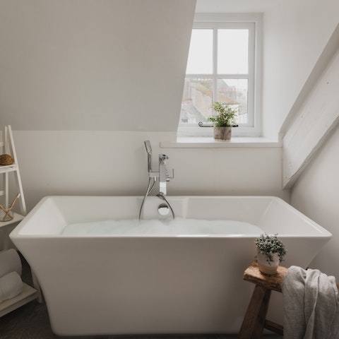 Sink into a warm bath after a day on the coast