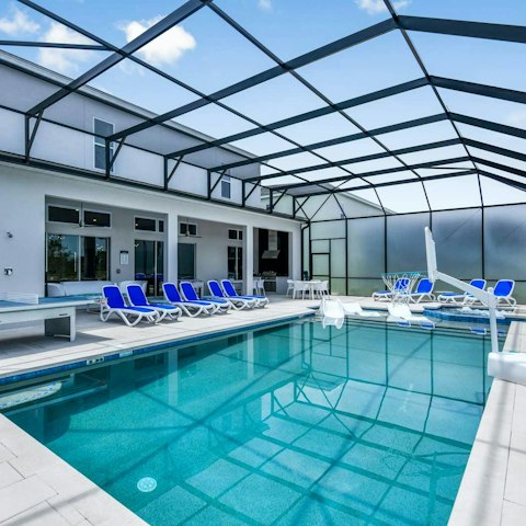 Relax and play in the large covered pool area