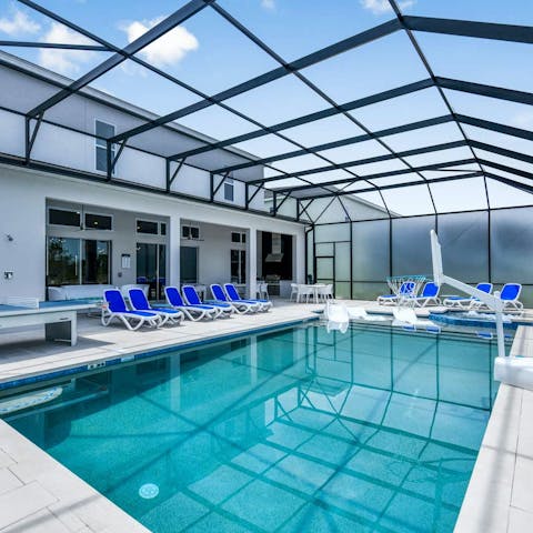Relax and play in the large covered pool area