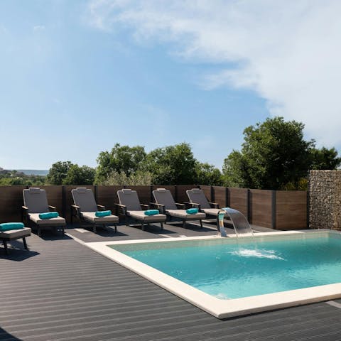 Spend easy days relaxing by the private pool