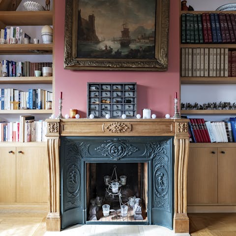 Curl up with a book in front of the ornate fireplace after sightseeing