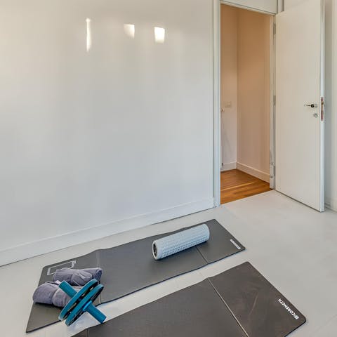 Wind down with a restorative yoga session in the home gym