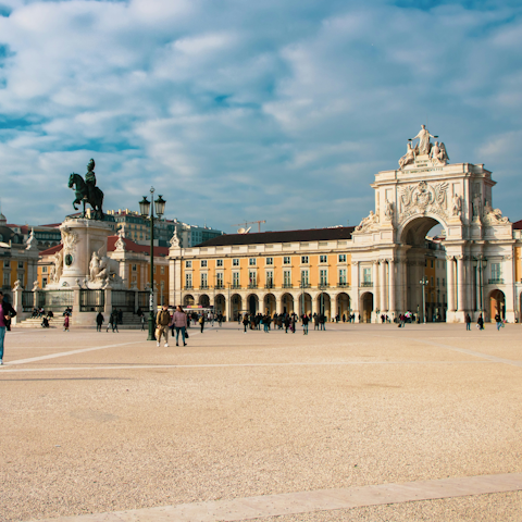 Start your morning with a wander around Praça do Comércio, less than fifteen minutes away
