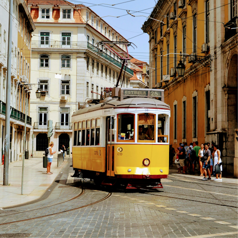Hop aboard Lisbon’s iconic yellow trams and explore the city’s historic neighbourhoods
