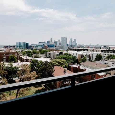 Take in skyline views of the city from your private balcony