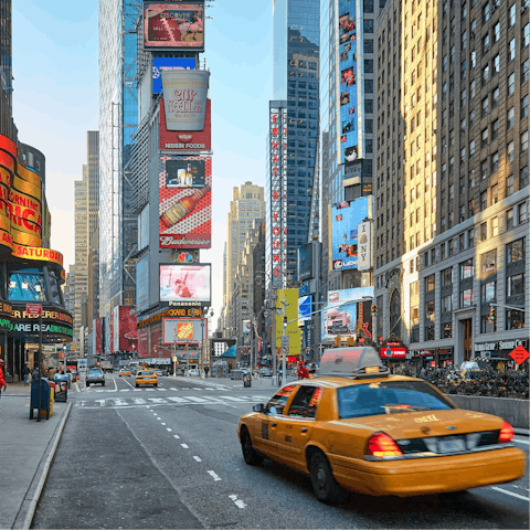 Catch a cab to the iconic Times Square and get lost in the bustle