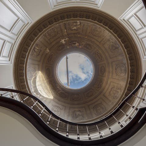 Enjoy a drink under the home's dome, featuring Greek philosophers 