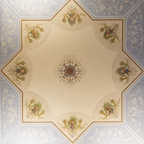 Admire the beautiful frescoes in this elegant home