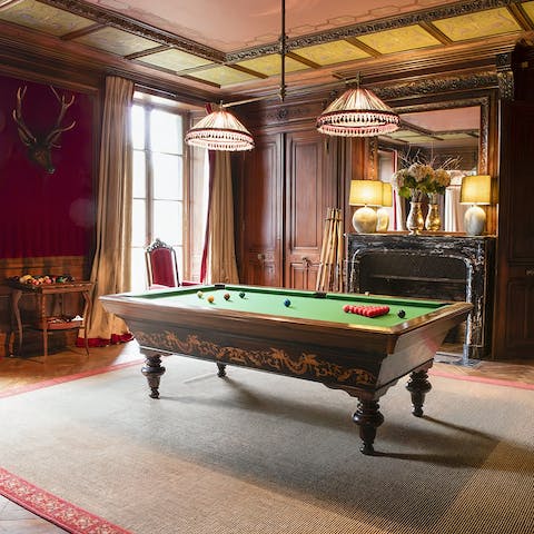 Enjoy a game of pool with a glass of smooth whiskey