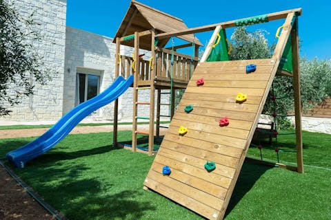 Let little ones run wild on the playground equipment in the garden