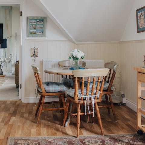 Nibble on the treats from the welcome hamper around the dining table