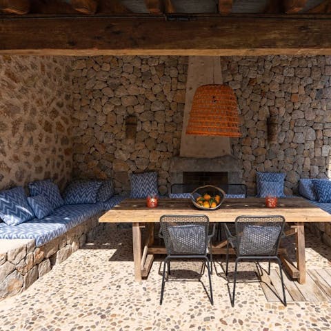 Enjoy some caracoles a la Mallorquina at the alfresco dining table