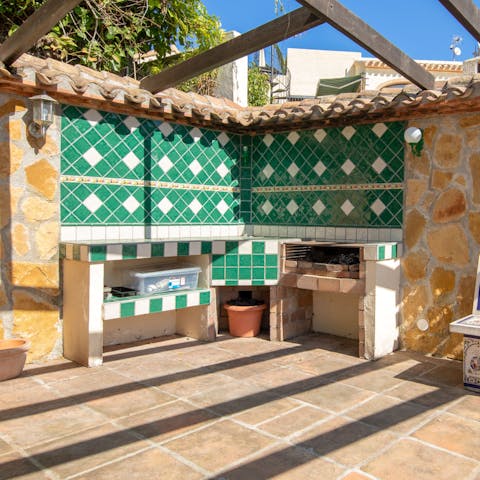 Grill fresh local fish on the traditionally tiled built-in barbecue