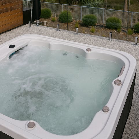Soak in the private hot tub on a cool evening