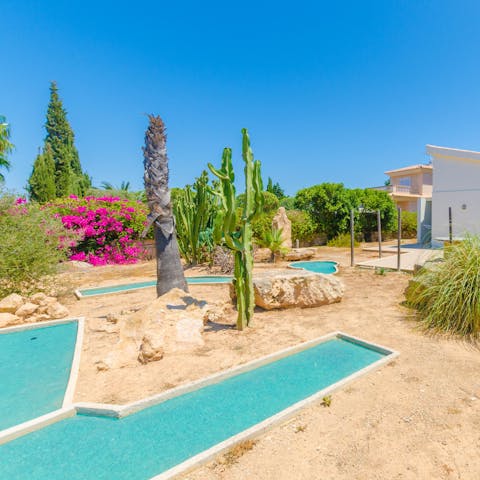 Hone your putting on the miniature golf course in the garden