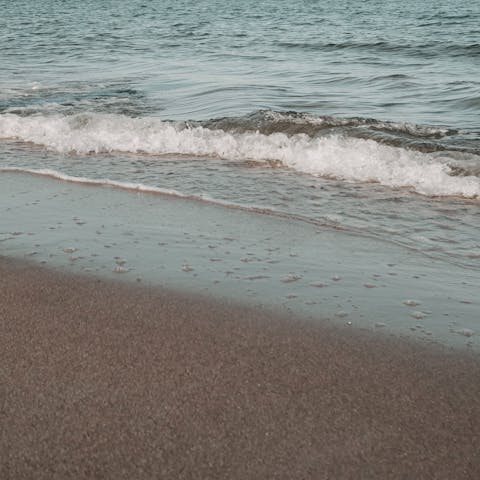 Spend the day on Calarossa Beach, a six-minute stroll from this home