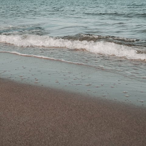 Spend the day on Calarossa Beach, a six-minute stroll from this home