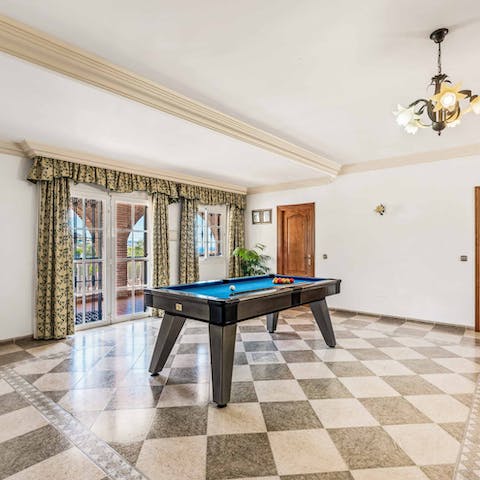 Challenge your loved ones to a game of billiards