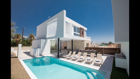 Stretch out on a sun lounger beside the sparkling pool