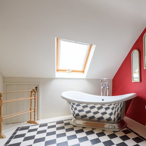 Treat yourself to a soak under the stars in the top floor en-suite bathroom