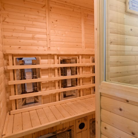 Indulge in a moment of calm while relaxing in the sauna