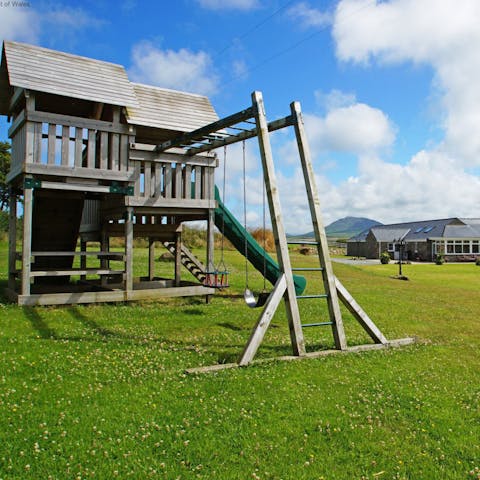 Supervise play sessions on the impressive wooden climbing frame