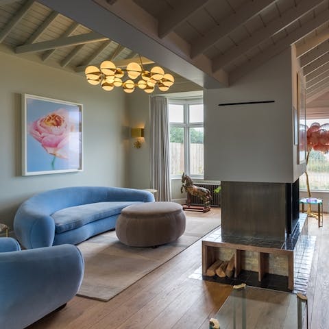 Recline on the sofa in this dramatic living space