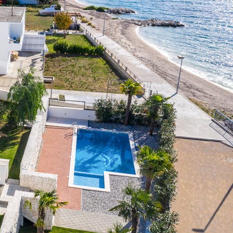Take a dip in the community pool by the beach