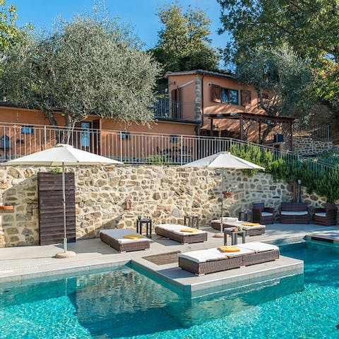 Relax on a sun lounger or sip a refreshing drink on the outdoor sofas