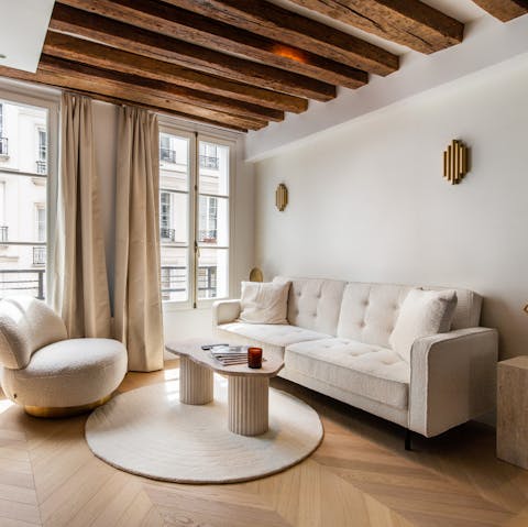 Admire the original beams in the light-filled living space