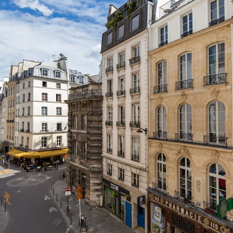 Peer out onto the bustle of the 1st Arrondissement below