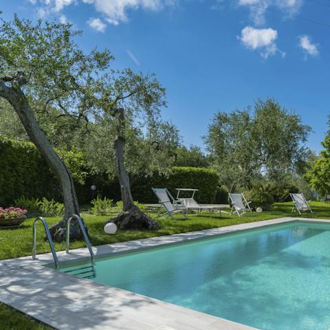 Swim a few lengths then stretch out on a sun lounger and relax