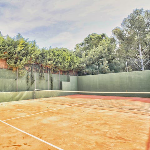 Head out for a morning game of tennis on Spain's famous red clay