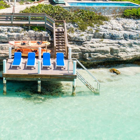 Take the kayaks out for a paddle on the crystal clear Sapodilla Bay