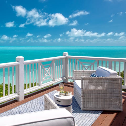 Sip a fruity cocktail as the sun sets over the pristine ocean