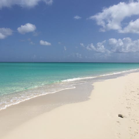 Stretch out on Taylor Bay Beach, a short walk from your home