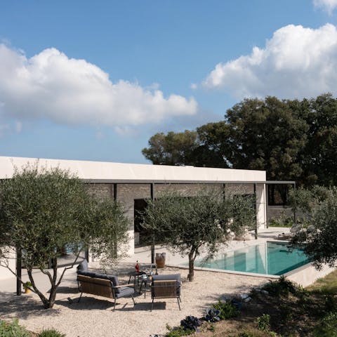 Swim in your private pool before drying off with a cocktail in the shade