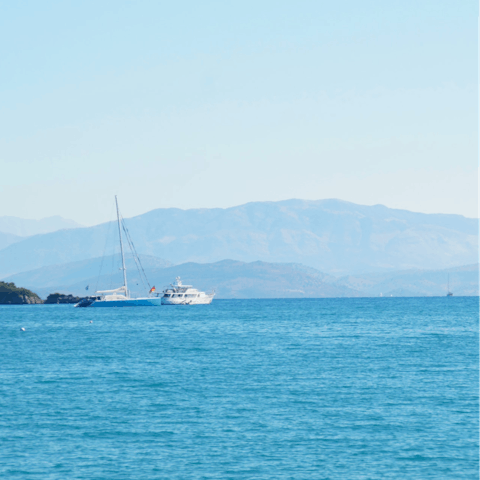 Drive ten minutes to Glyfada Beach to snorkel in the clear water