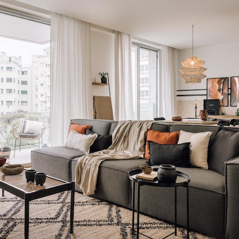 Relax and unwind on the plush sofa in the living room