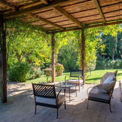 Sit underneath the pergola with a cold cocktail and nibbles